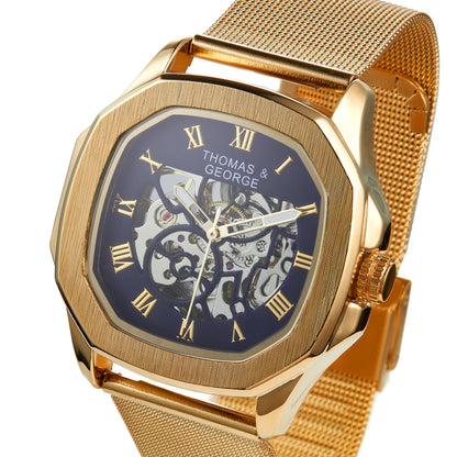 Thomas & George Berlin Gold Edition Automatic Skeleton Watch | Cushion-Shaped Gold-Tone Alloy Case & Roman Numeral Dial | Stainless Steel Mesh Strap