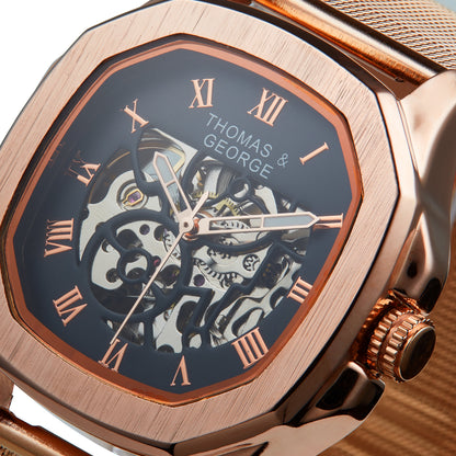 Thomas & George Berlin Rose Gold Edition Automatic Skeleton Watch | Cushion-Shaped Alloy Case & Roman Numeral Dial | Stainless Steel Mesh Strap