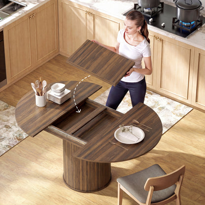 Extendable Dining Table | 110–150cm Round to Oval | Dark Walnut-Effect Finish & Fluted Pedestal Base | Hidden Extension Leaf Storage | Seats up to 6–8