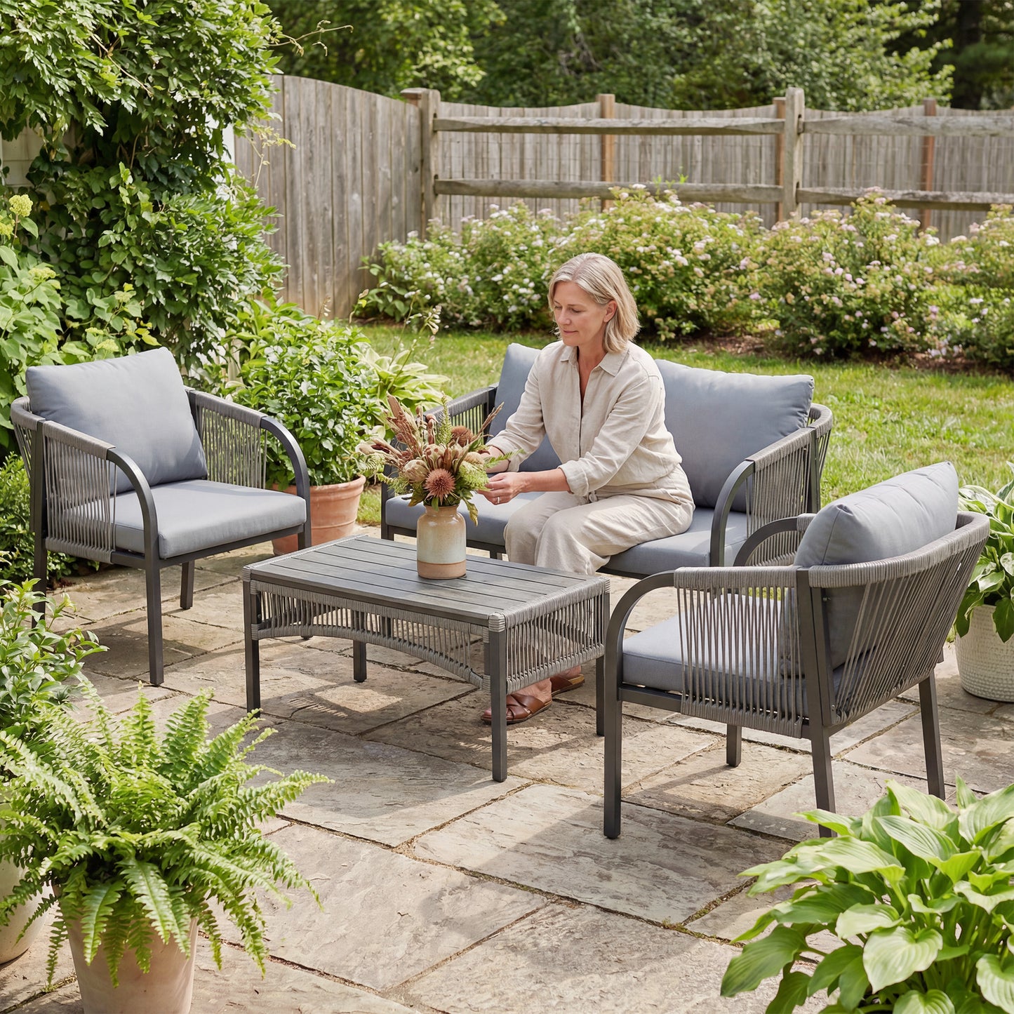 4 Piece Rattan Garden Furniture Set | Loveseat | 2 Armchairs | Wood-Effect WPC Coffee Table | Round PE Wicker | Powder-Coated Steel | Washable Cushions | 120kg | Grey